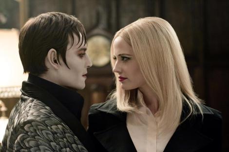 Johnny Depp, left, and Eva Green are shown in a scene from "Dark Shadows." (Photo credit: Warner Bros.)
