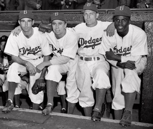In this April 15, 1947 file photo,  from left, Brooklyn Dodgers baseball players John Jorgensen, Pee Wee Reese, Ed Stanky and Jackie Robinson pose at Ebbets Field in New York. (Photo credit: AP file photo)