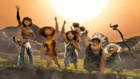 Above, from left, Belt the sloth, voiced by Chris Sanders, Guy, voiced by Ryan Reynolds, Eep, voiced by Emma Stone, Ugga, voiced by Catherine Keener, holding Sandy, voiced by Randy Thom, Thunk, voiced by Clark Duke, Gran, voiced by Cloris Leachman, in a scene from "The Croods." (Photo credit: AP photo by DreamWorks Animation)