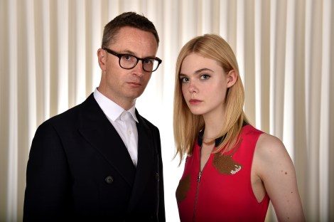 Director Nicolas Winding Refn (left) poses with actress Elle Fanning to promote their film, "The Neon Demon," in Los Angeles. (Photo credit: Jordan Strauss/Invision/AP)